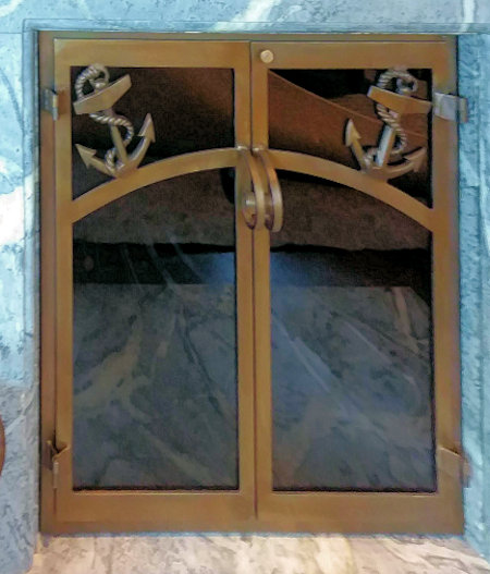 Mariners horizon fireplace doors inside fit all architectural bronze finish with anchor motif. twin doors with extension hinges and smoked glass. Comes with slide mesh